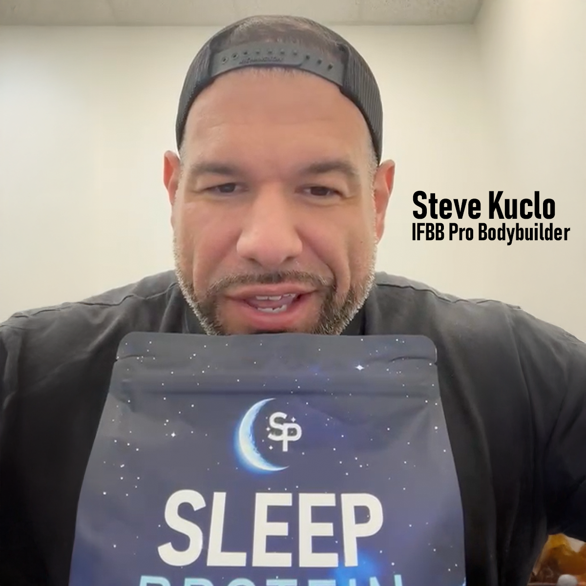 Steve Kuclo, IFBB Pro with a bag of Sleep Protein